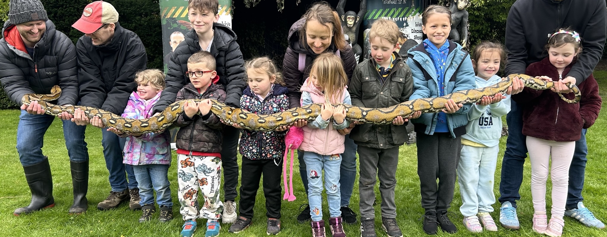 Small group holding snake